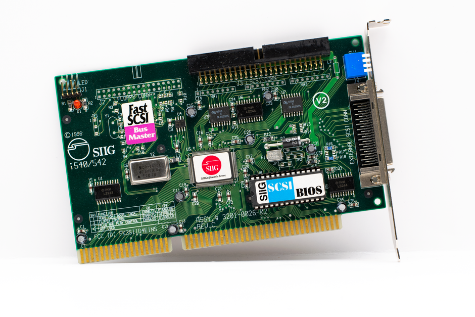 Close-up of a vintage SCSI circuit board showcasing its microchip design and components.
