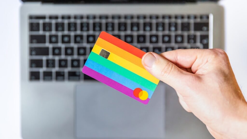 payment integration patterns — person holding yellow and pink card