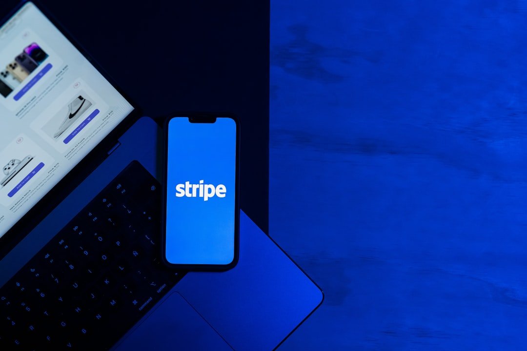 A laptop computer sitting on top of a blue table